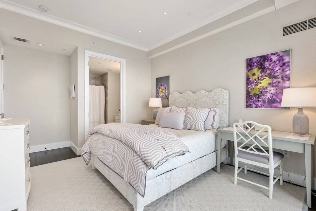 22 Liberty Drive, Unit 6A Boston, MA 02210 - Photo 21 of 42 a bedroom with a bed and a dresser