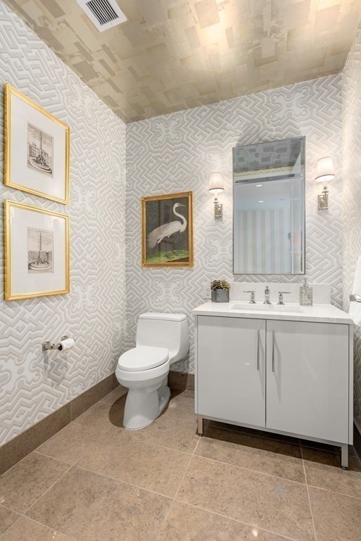 22 Liberty Drive, Unit 6A Boston, MA 02210 - Photo 23 of 42 a bathroom with a sink mirror and toilet