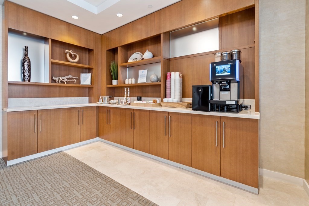 22 Liberty Drive, Unit 6A Boston, MA 02210 - Photo 40 of 42 a kitchen with stainless steel appliances granite countertop a sink and cabinets