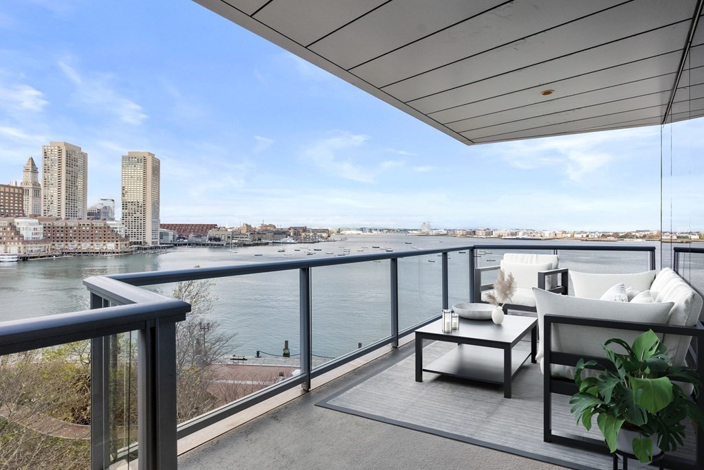 22 Liberty Drive, Unit 6A Boston, MA 02210 - Photo 6 of 42 a view of a balcony with two chairs and a table