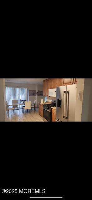 13 Ridge Road West Long Branch, NJ 07764 - Photo 3 of 3 a upper view of whole floor with a black and white kitchen