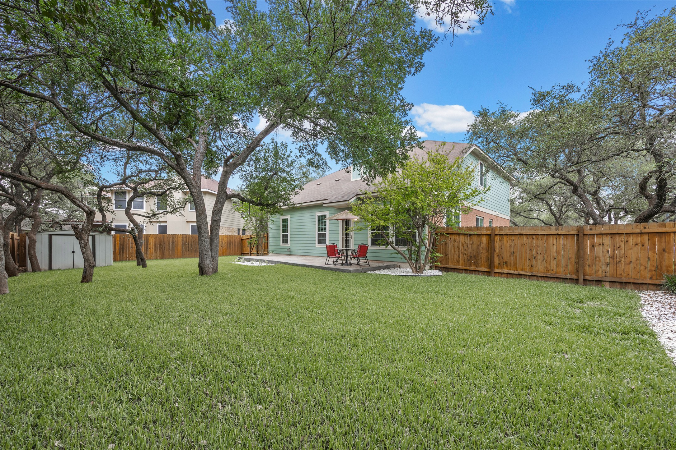 8610 Axis Drive Austin, TX 78749 - Photo 8 of 29 a view of a yard with a house and a large tree