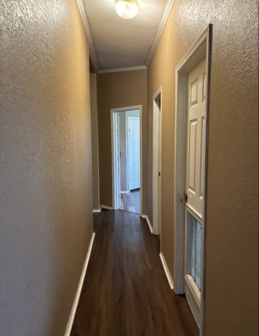 4021 Baker Road Needville, TX 77461 - Photo 13 of 14 a view of a hallway with wooden floor and a door