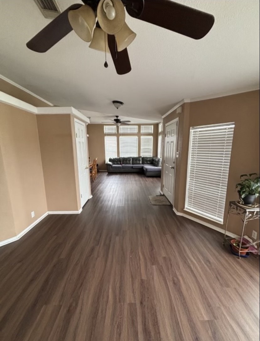 4021 Baker Road Needville, TX 77461 - Photo 5 of 14 wooden floor in an empty room with a window