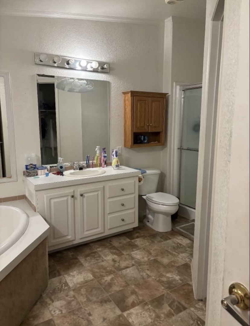 4021 Baker Road Needville, TX 77461 - Photo 8 of 14 a bathroom with a double vanity sink and a mirror
