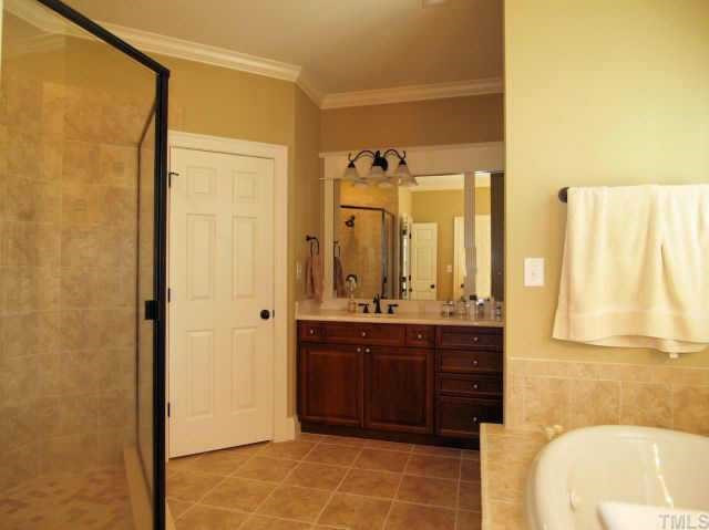 118 Montgomery Street Raleigh, NC 27607 - Photo 8 of 10 The spacious master bathroom features his/her vanities, a roomy tiled shower, a deep whirlpool tub and separate water closet. Other