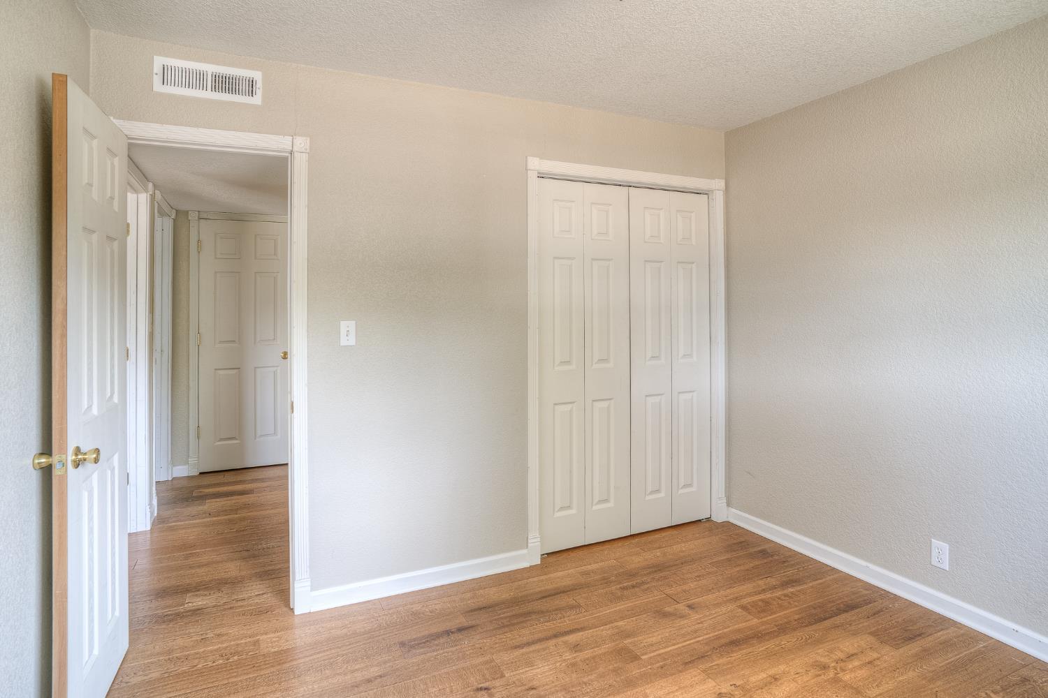 5463 Hankins Road Williams, CA 95987 - Photo 22 of 62 a view of an empty room with wooden floor