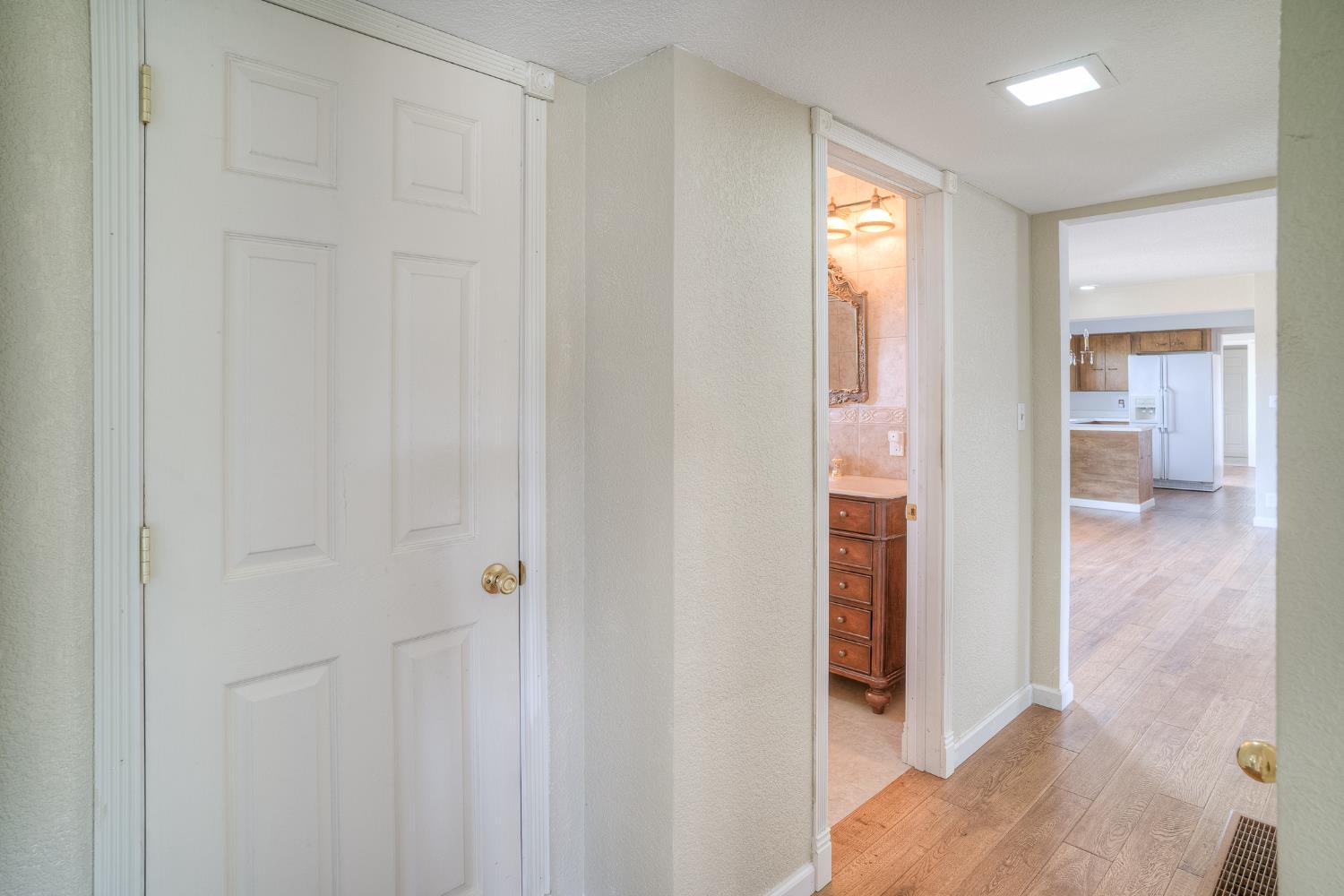 5463 Hankins Road Williams, CA 95987 - Photo 23 of 62 a view of a hallway with wooden floor and closet