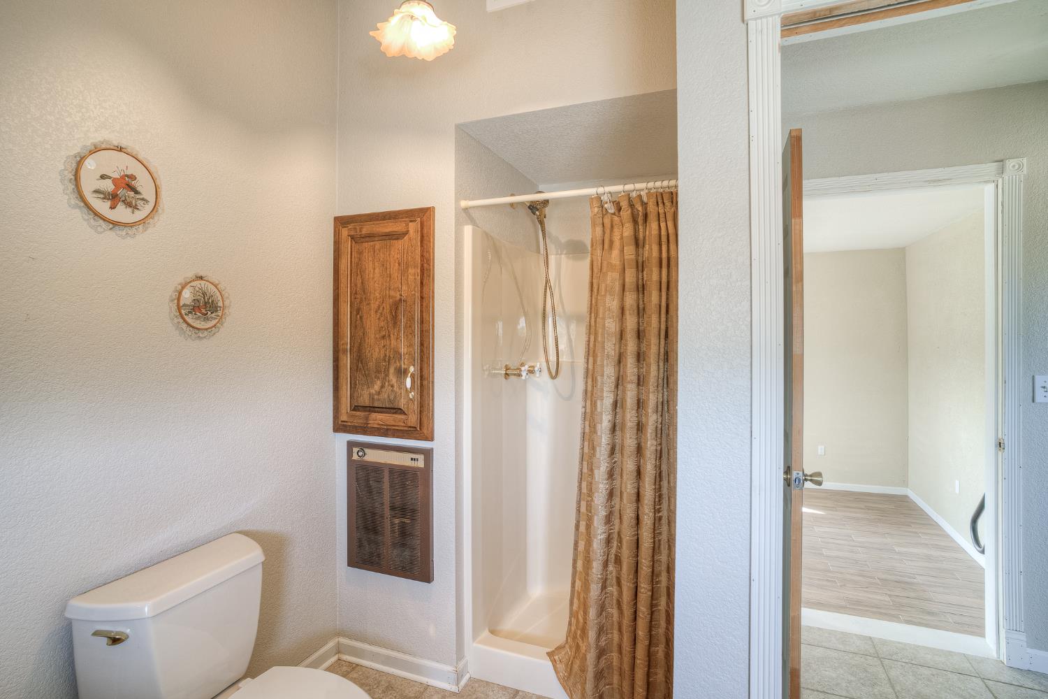 5463 Hankins Road Williams, CA 95987 - Photo 31 of 62 a bathroom with a toilet and a shower