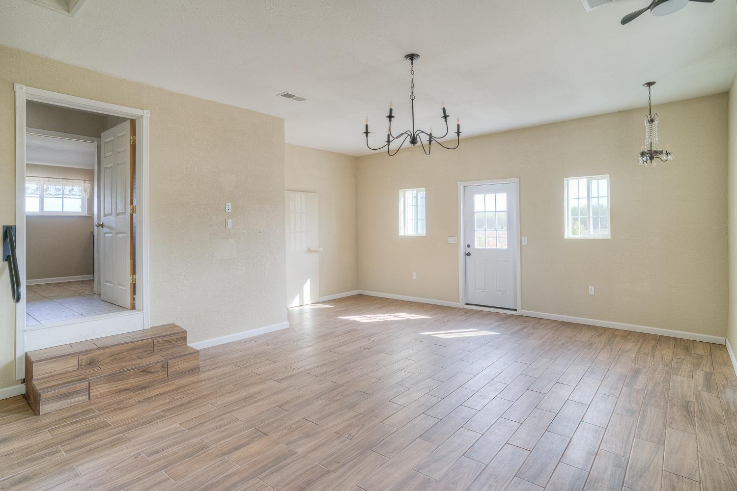 5463 Hankins Road Williams, CA 95987 - Photo 34 of 62 a view of an empty room with wooden floor and a window