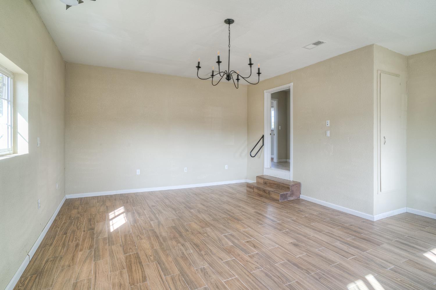 5463 Hankins Road Williams, CA 95987 - Photo 35 of 62 wooden floor in an empty room with a window