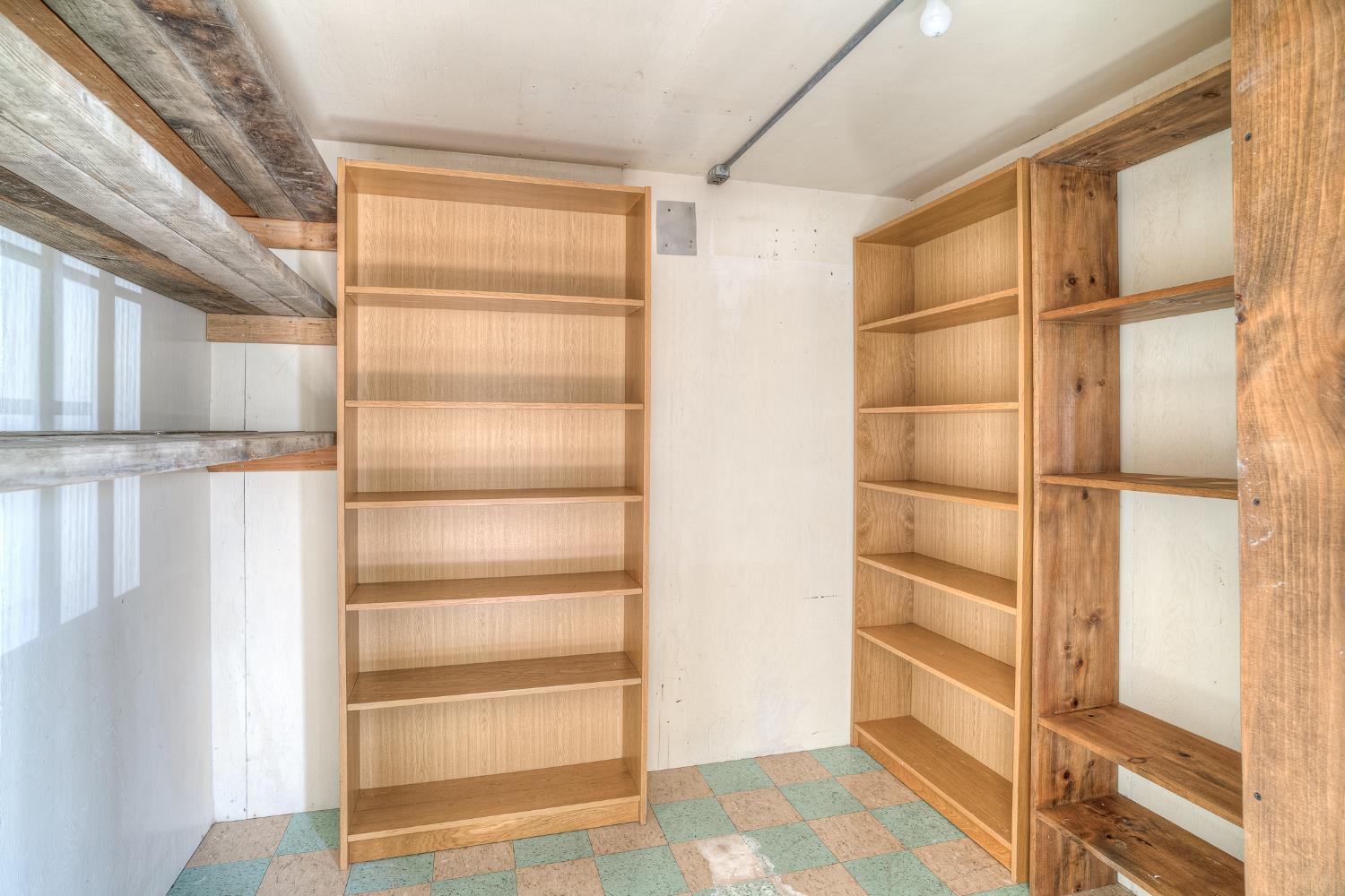 5463 Hankins Road Williams, CA 95987 - Photo 37 of 62 a view of walk in closet with empty racks