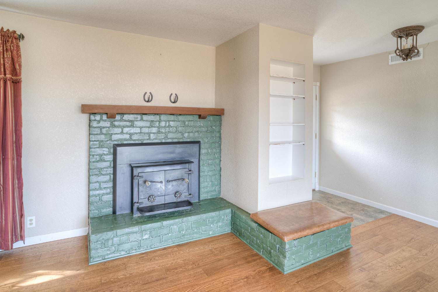 5463 Hankins Road Williams, CA 95987 - Photo 6 of 62 a living room with a fireplace