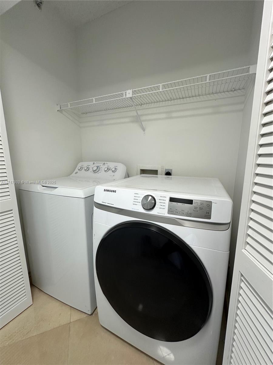 8855 Collins Avenue, Unit 8A Surfside, FL 33154 - Photo 11 of 15 a utility room with dryer and washer