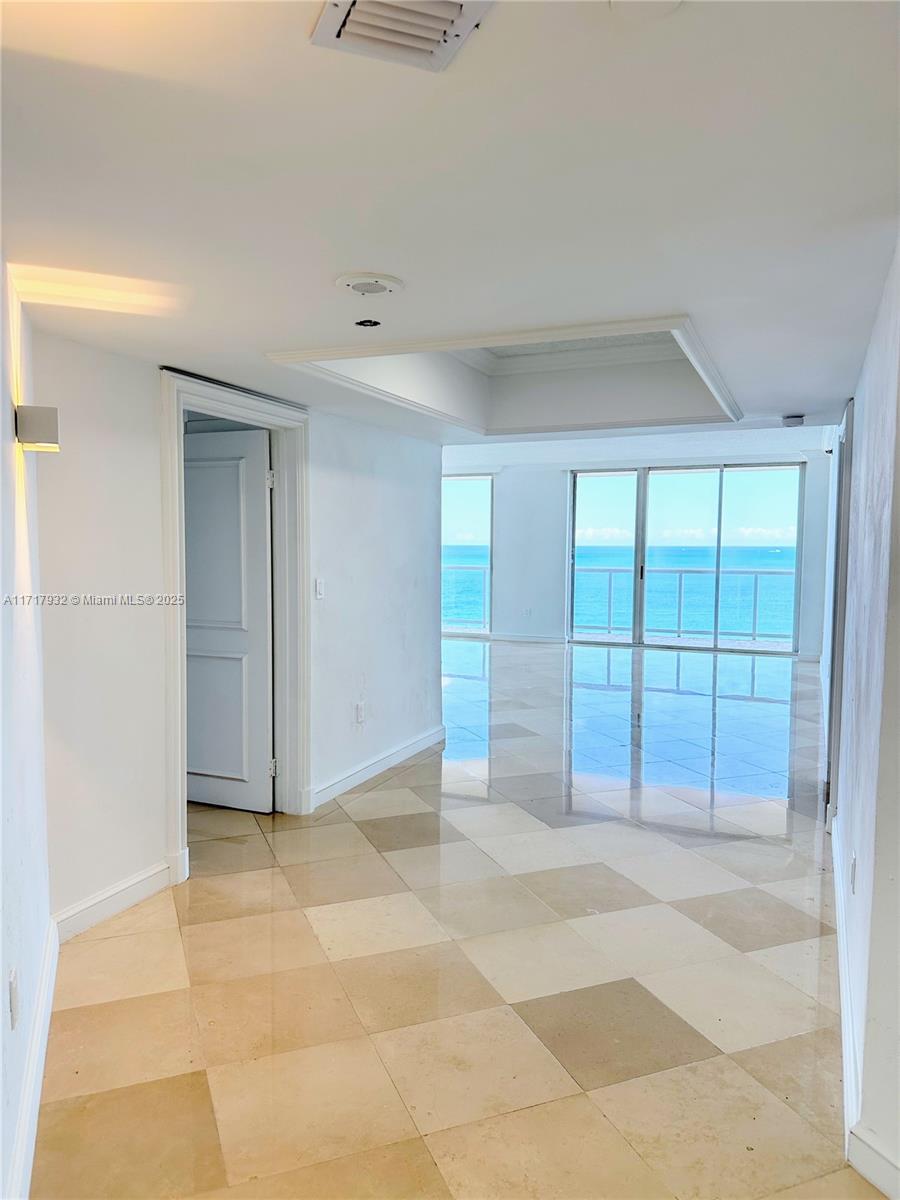 8855 Collins Avenue, Unit 8A Surfside, FL 33154 - Photo 3 of 15 a view of an empty room with a window