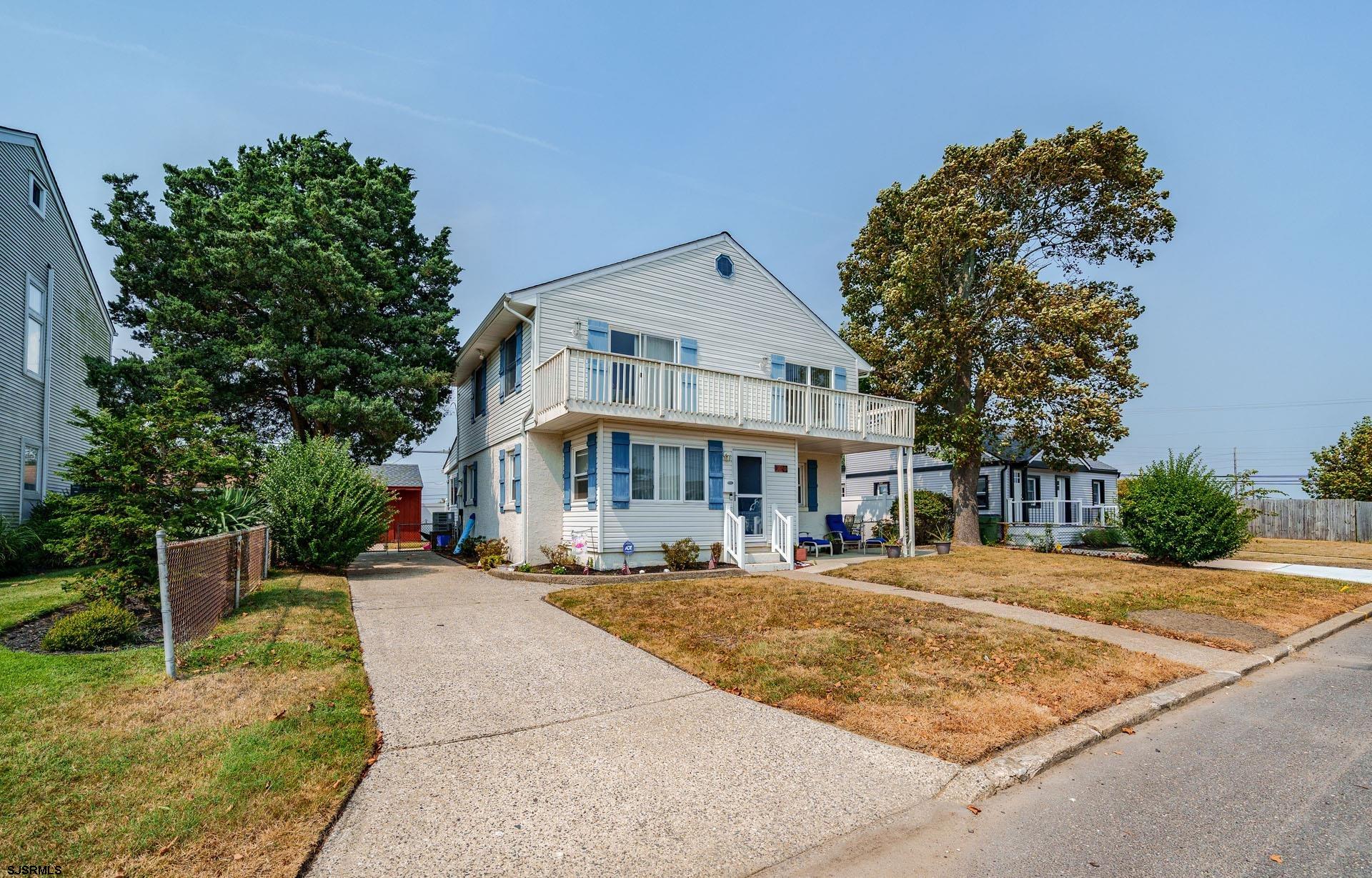 205 East Plaza Place Egg Harbor Township, NJ 08232 - Photo 1 of 31 a front view of a house with a garden