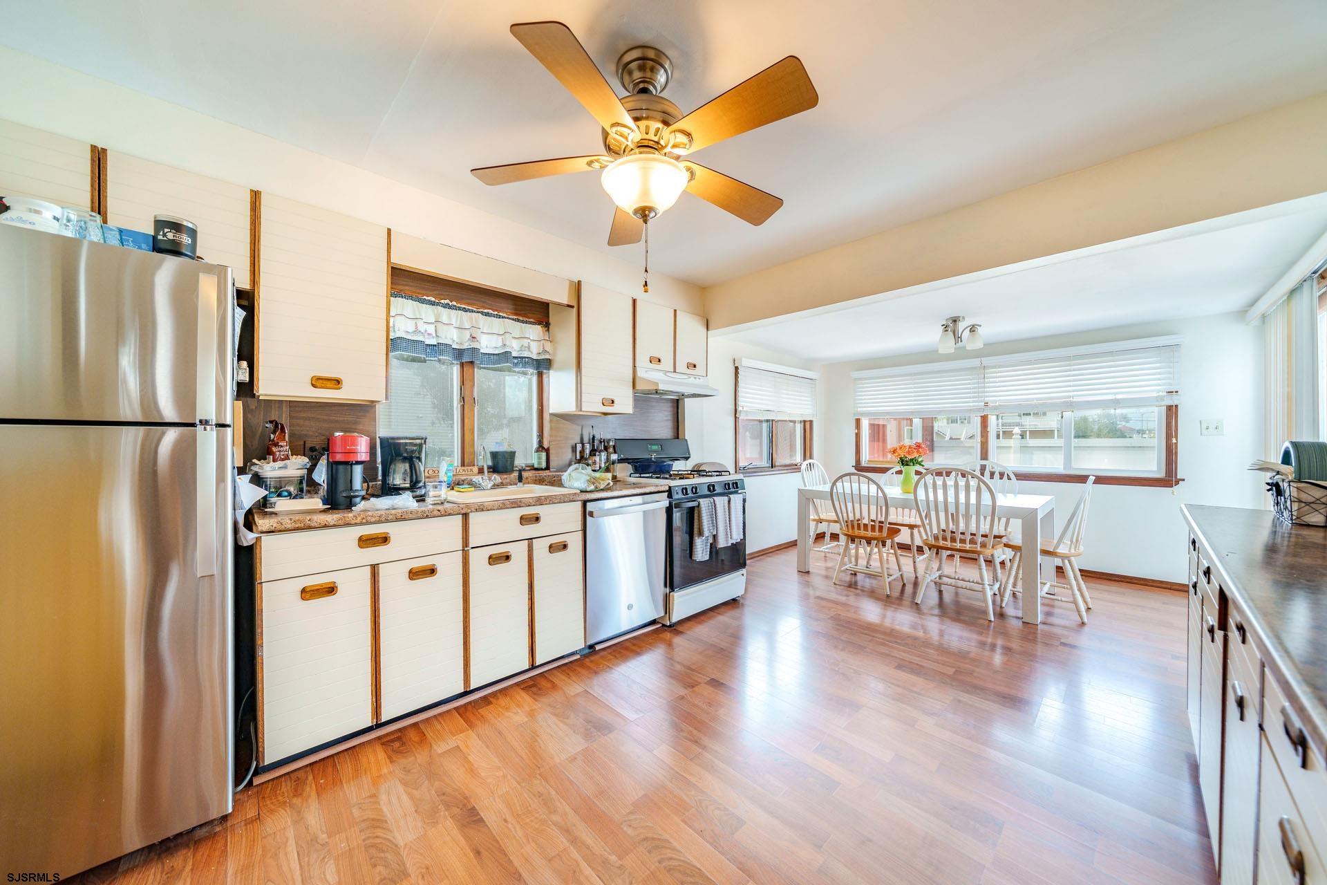 205 East Plaza Place Egg Harbor Township, NJ 08232 - Photo 12 of 31 a kitchen with white cabinets and white appliances