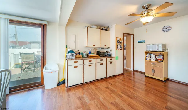 a kitchen with stainless steel appliances a stove top oven and a refrigerator
