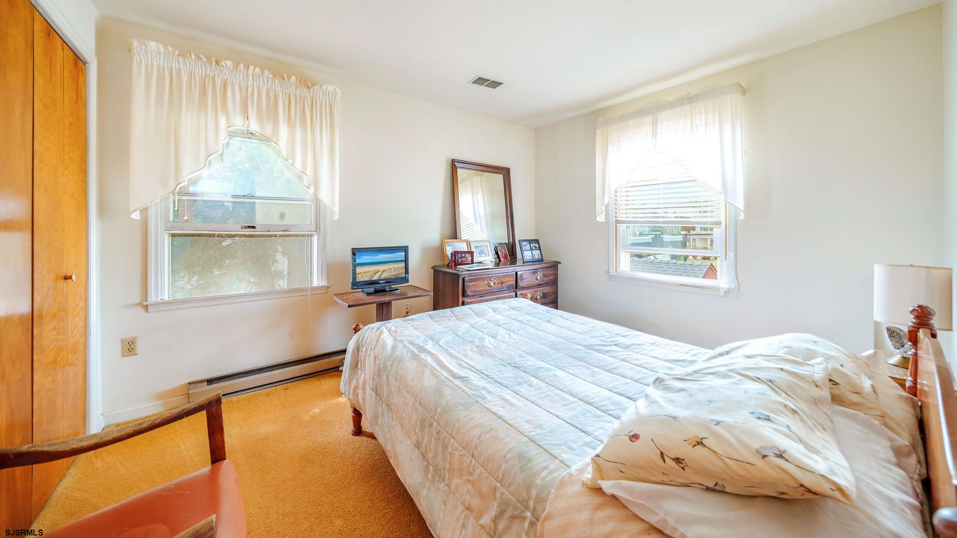 205 East Plaza Place Egg Harbor Township, NJ 08232 - Photo 20 of 31 a bed sitting in a bedroom next to a window