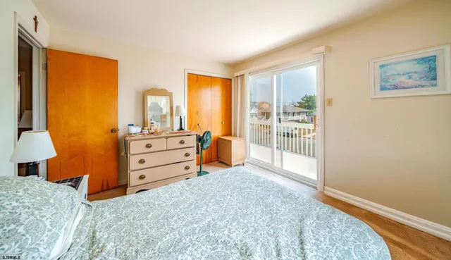 a bed room with a bed and a window