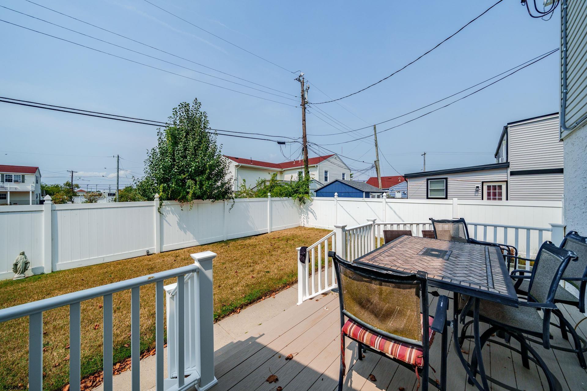 205 East Plaza Place Egg Harbor Township, NJ 08232 - Photo 30 of 31 a outdoor dining space with furniture and wooden floor