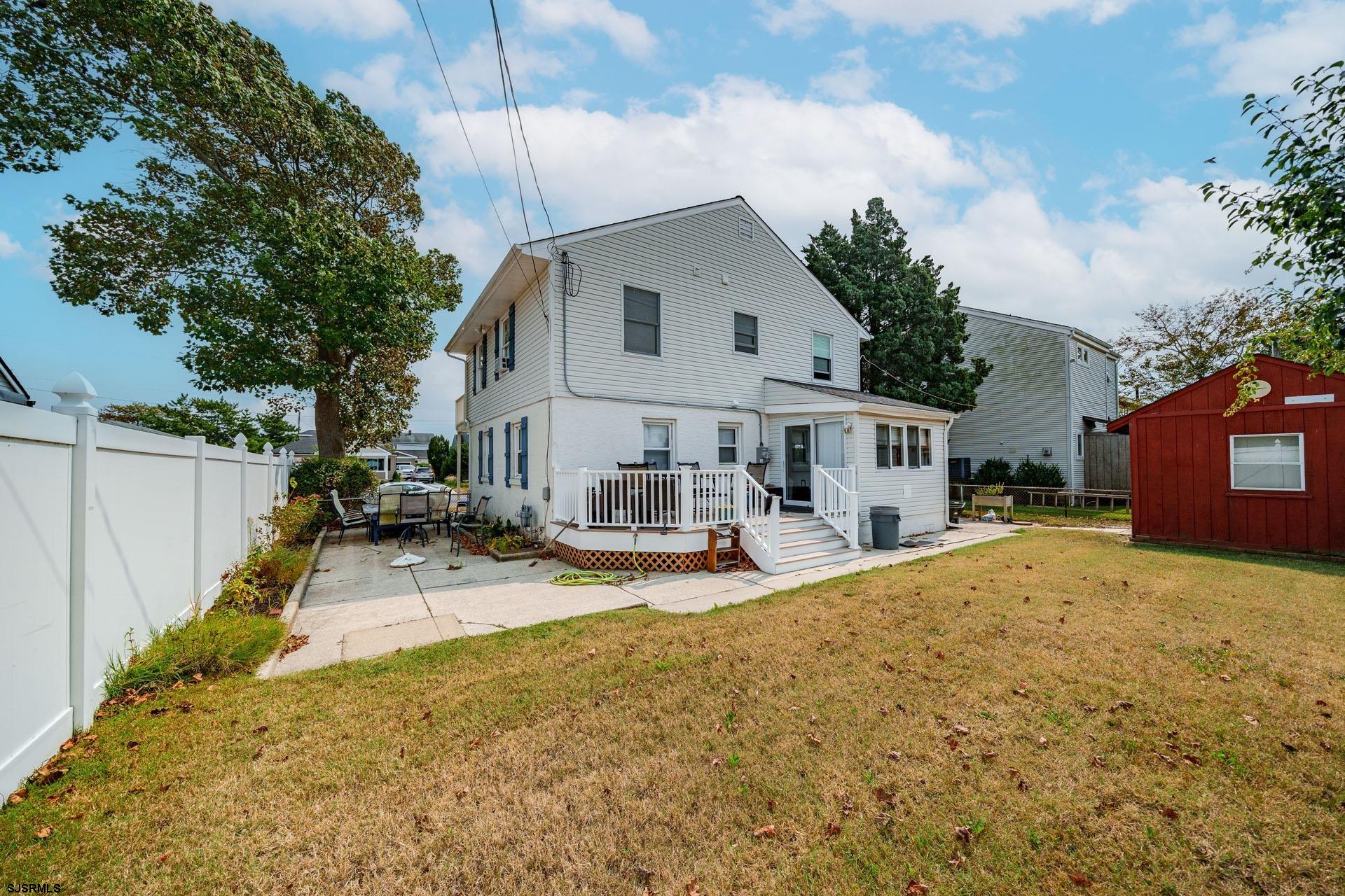 205 East Plaza Place Egg Harbor Township, NJ 08232 - Photo 4 of 31 a view of a house with snow on the side of the road