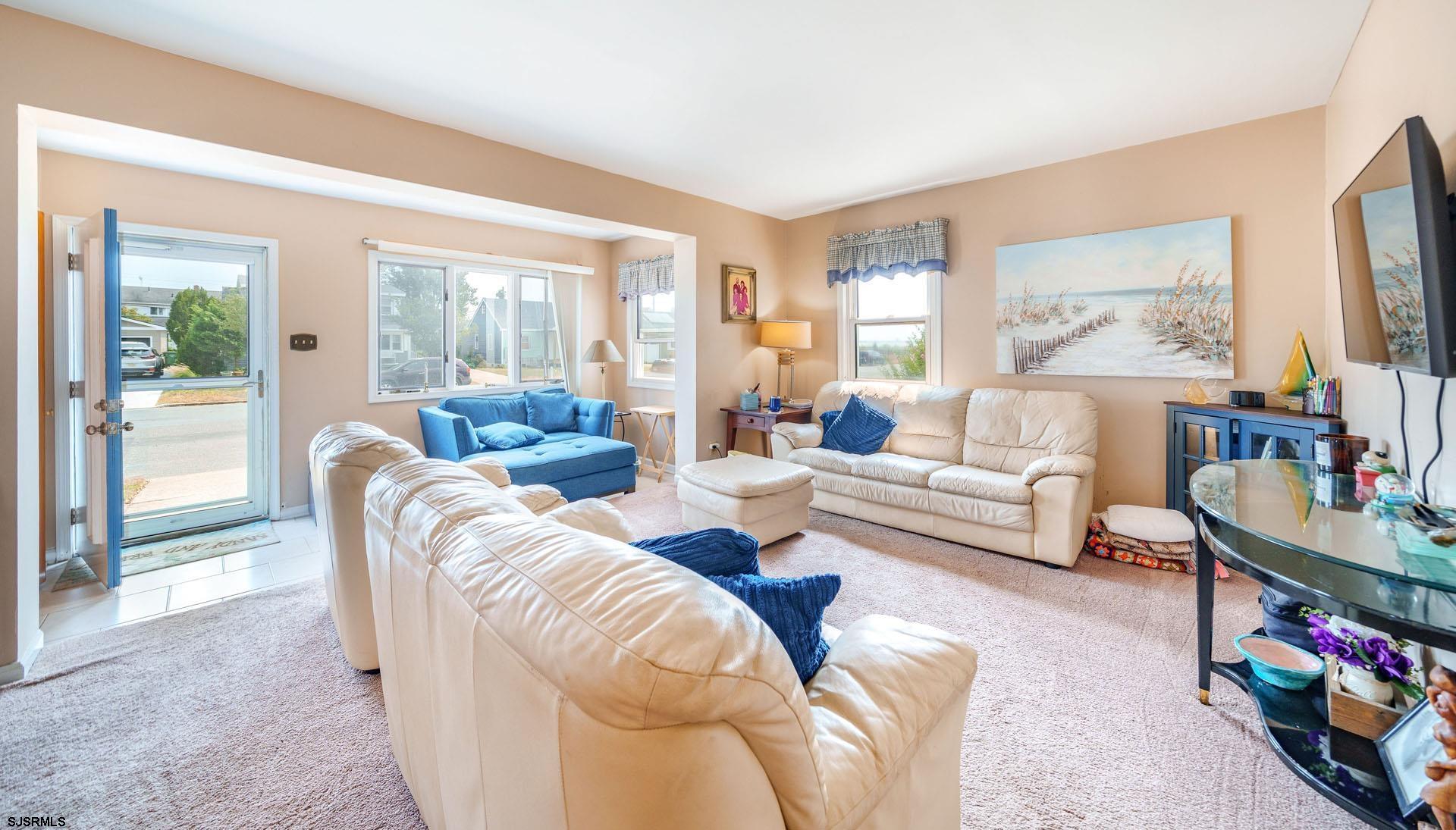205 East Plaza Place Egg Harbor Township, NJ 08232 - Photo 5 of 31 a living room with furniture and a large window