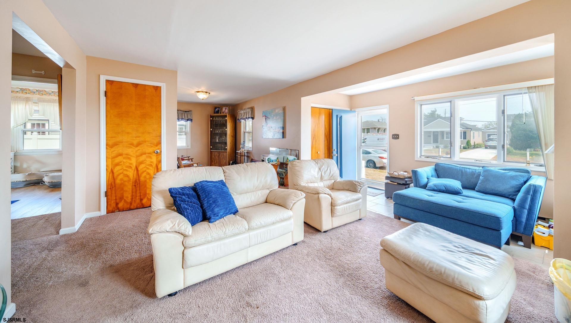 205 East Plaza Place Egg Harbor Township, NJ 08232 - Photo 7 of 31 a living room with furniture and a large window