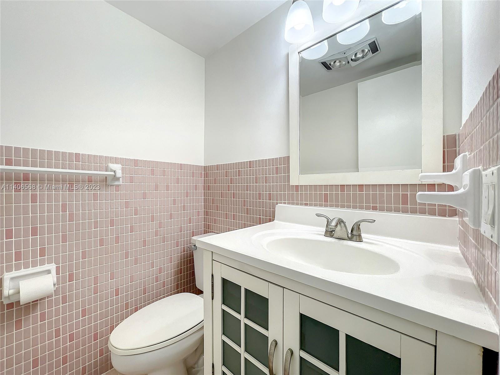320 South Surf Road, Unit 502 Hollywood, FL 33019 - Photo 27 of 45 a bathroom with a sink a toilet and shower