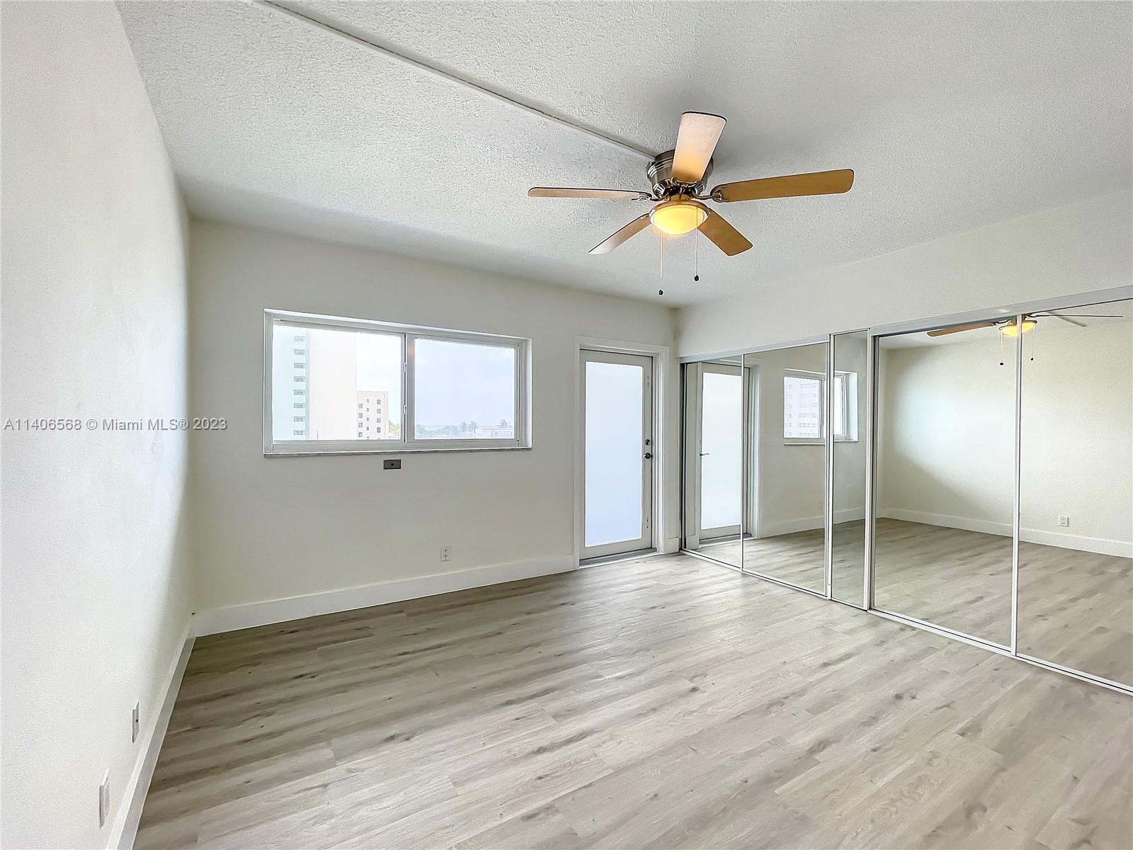 320 South Surf Road, Unit 502 Hollywood, FL 33019 - Photo 30 of 45 a view of an empty room with window and wooden floor