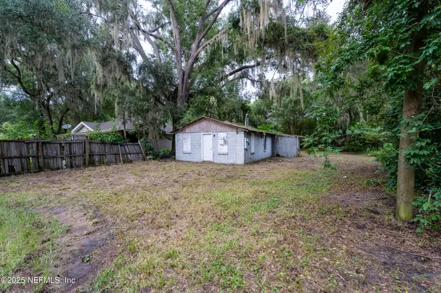 a house view with a backyard space
