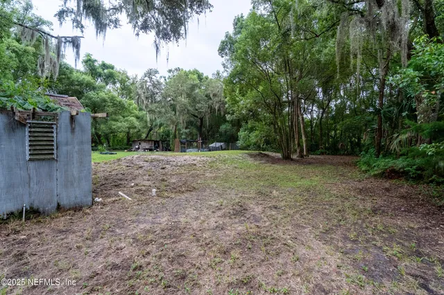 a view of outdoor space with deck and yard