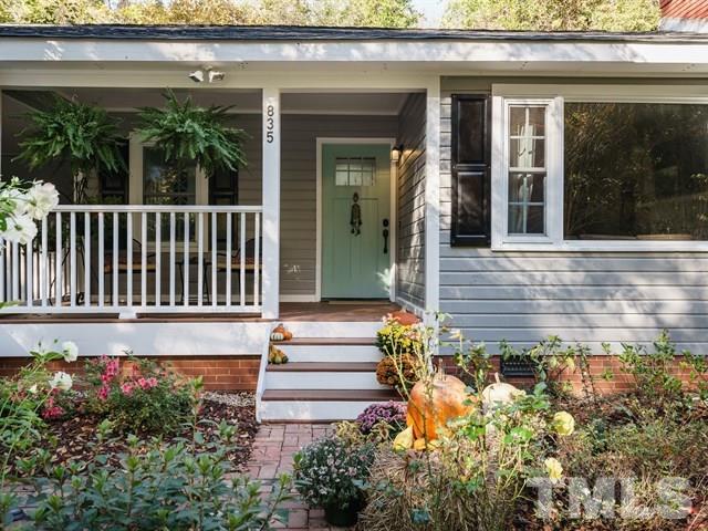 835 Brookside Drive Raleigh, NC 27604 - Photo 1 of 24 a view of a house with a flower garden