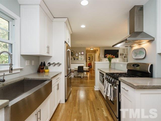 835 Brookside Drive Raleigh, NC 27604 - Photo 12 of 24 a kitchen with stove and cabinets