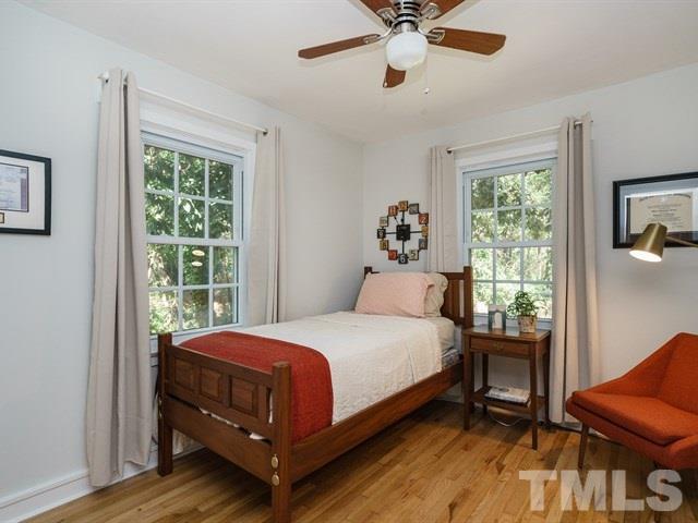 835 Brookside Drive Raleigh, NC 27604 - Photo 14 of 24 a bedroom with a bed and wooden floor