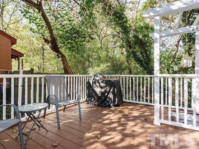 835 Brookside Drive Raleigh, NC 27604 - Photo 18 of 24 a view of a bench in wooden floor
