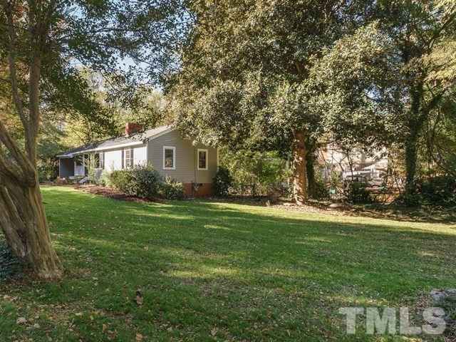 835 Brookside Drive Raleigh, NC 27604 - Photo 22 of 24 a view of a house with backyard and trees