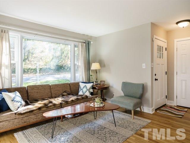 835 Brookside Drive Raleigh, NC 27604 - Photo 6 of 24 a living room with furniture and a window