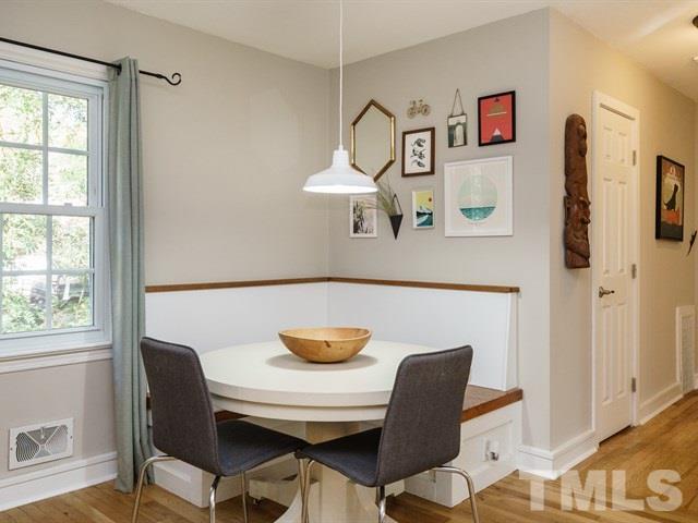 835 Brookside Drive Raleigh, NC 27604 - Photo 8 of 24 a view of a dining room with furniture and wooden floor