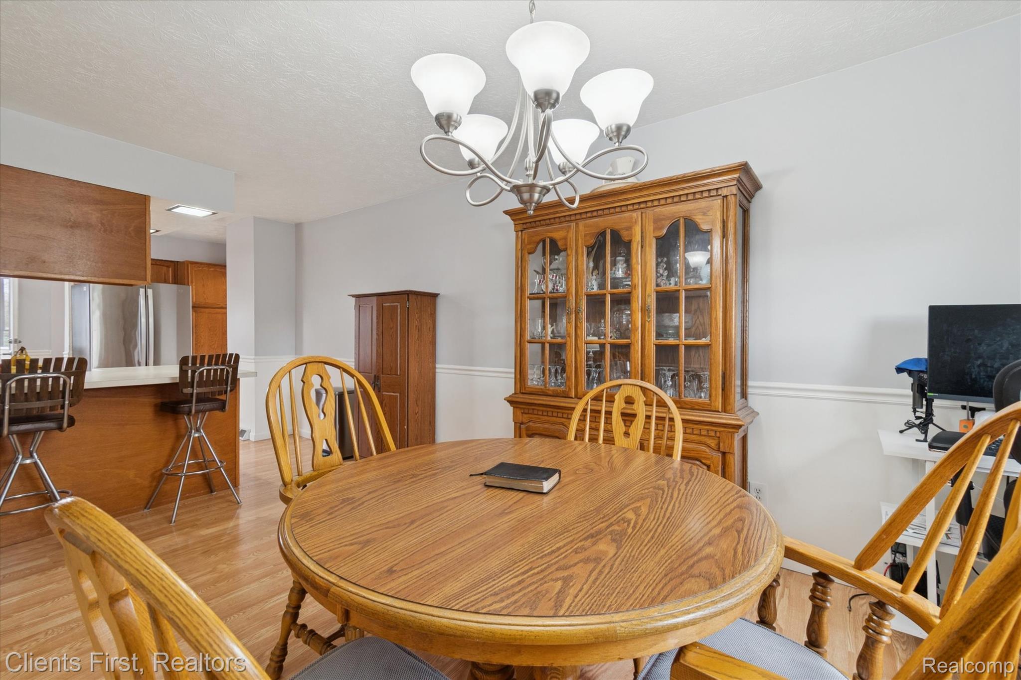 6550 Hitchingham Road Ypsilanti, MI 48197 - Photo 10 of 53 Dining space with a chandelier, light wood finished floors, and a textured ceiling