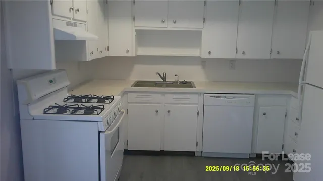 a view of cabinets and window