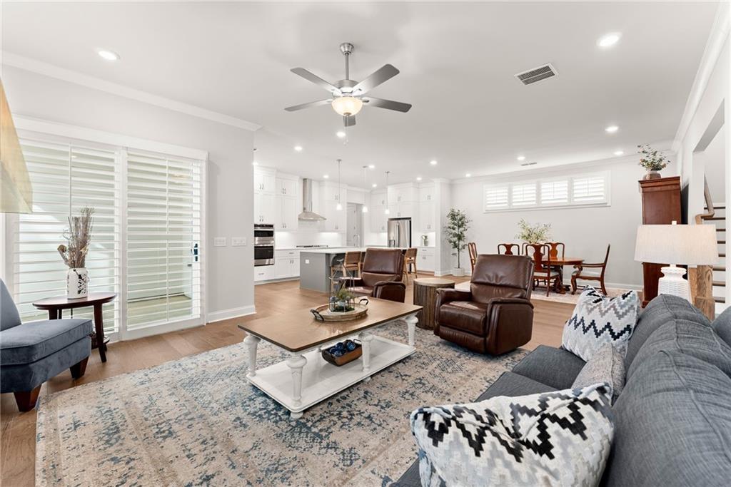 504 Pearl Street Cumming, GA 30040 - Photo 13 of 52 a living room with furniture and kitchen view