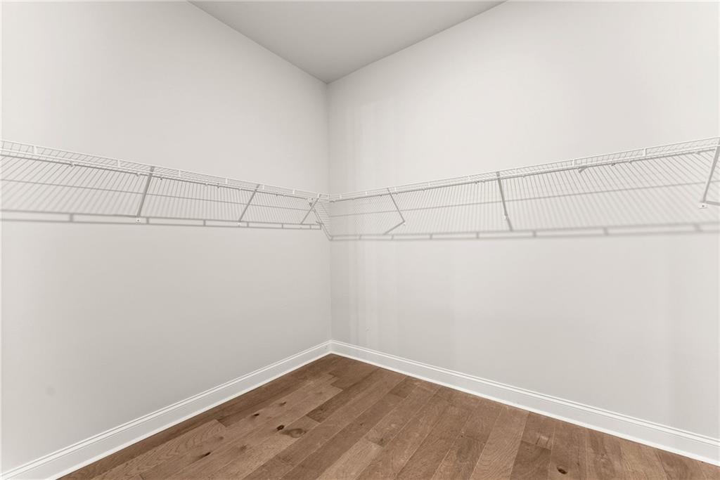 504 Pearl Street Cumming, GA 30040 - Photo 23 of 52 a view of a room with racks on the wall