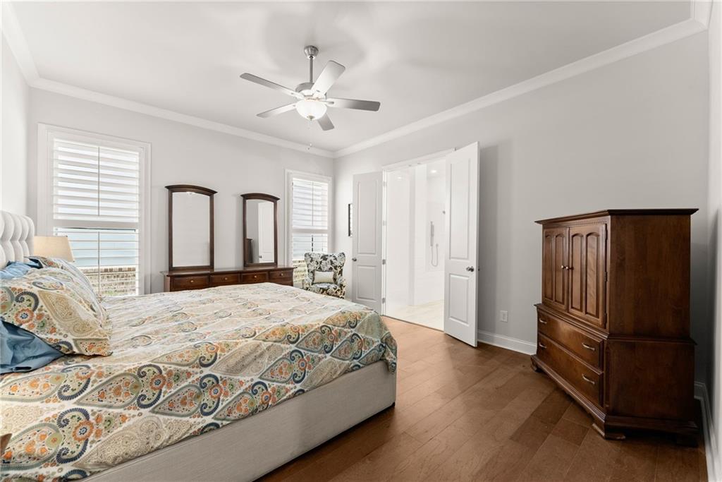 504 Pearl Street Cumming, GA 30040 - Photo 26 of 52 a bedroom with a bed closet and a window