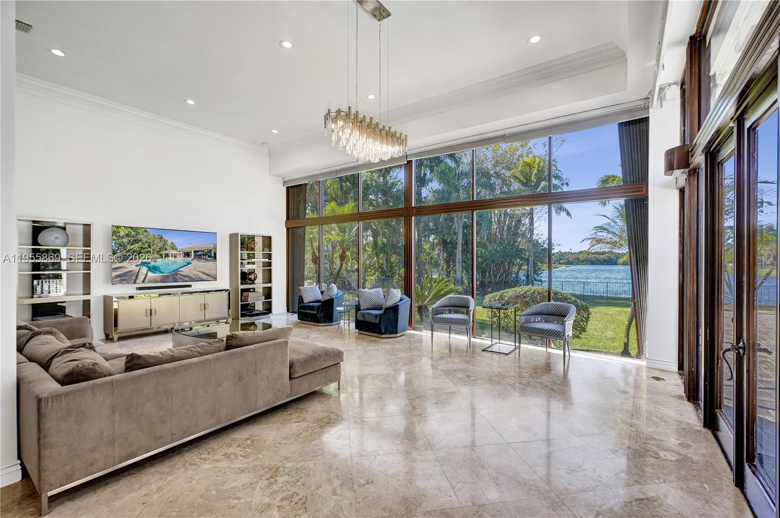 3175 Hunter Road Weston, FL 33331 - Photo 12 of 45 a living room with furniture and a large window