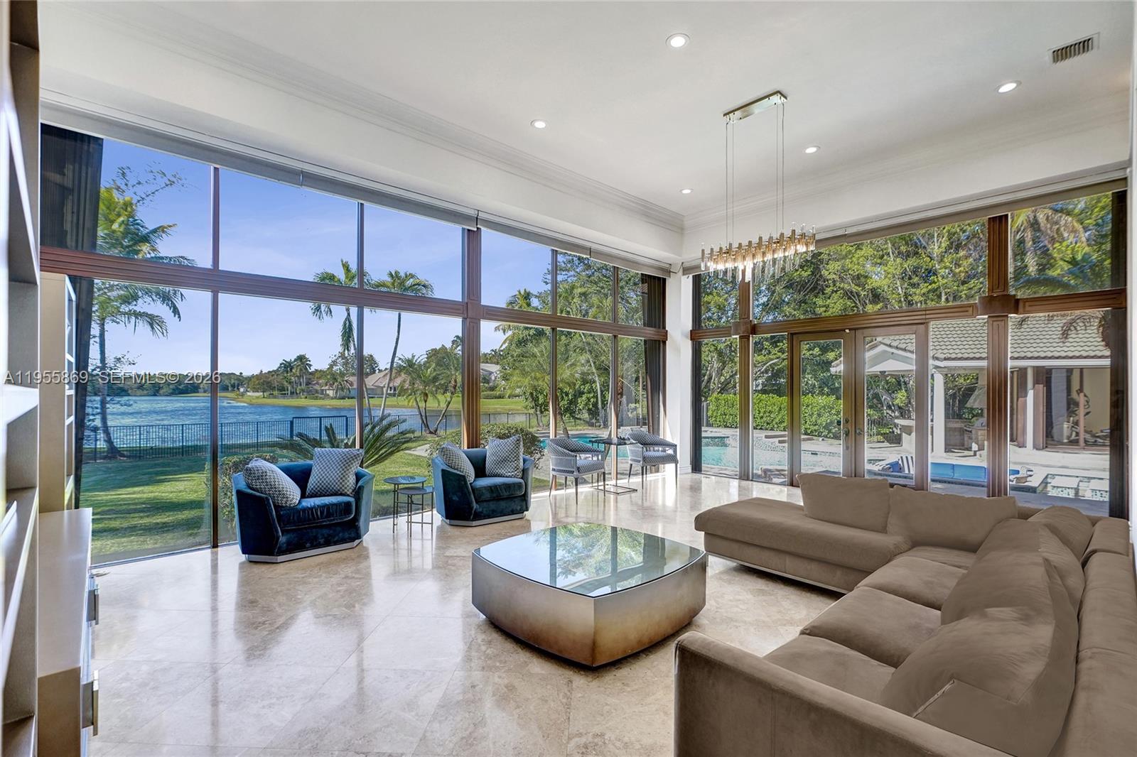3175 Hunter Road Weston, FL 33331 - Photo 13 of 45 a living room with furniture and a large window