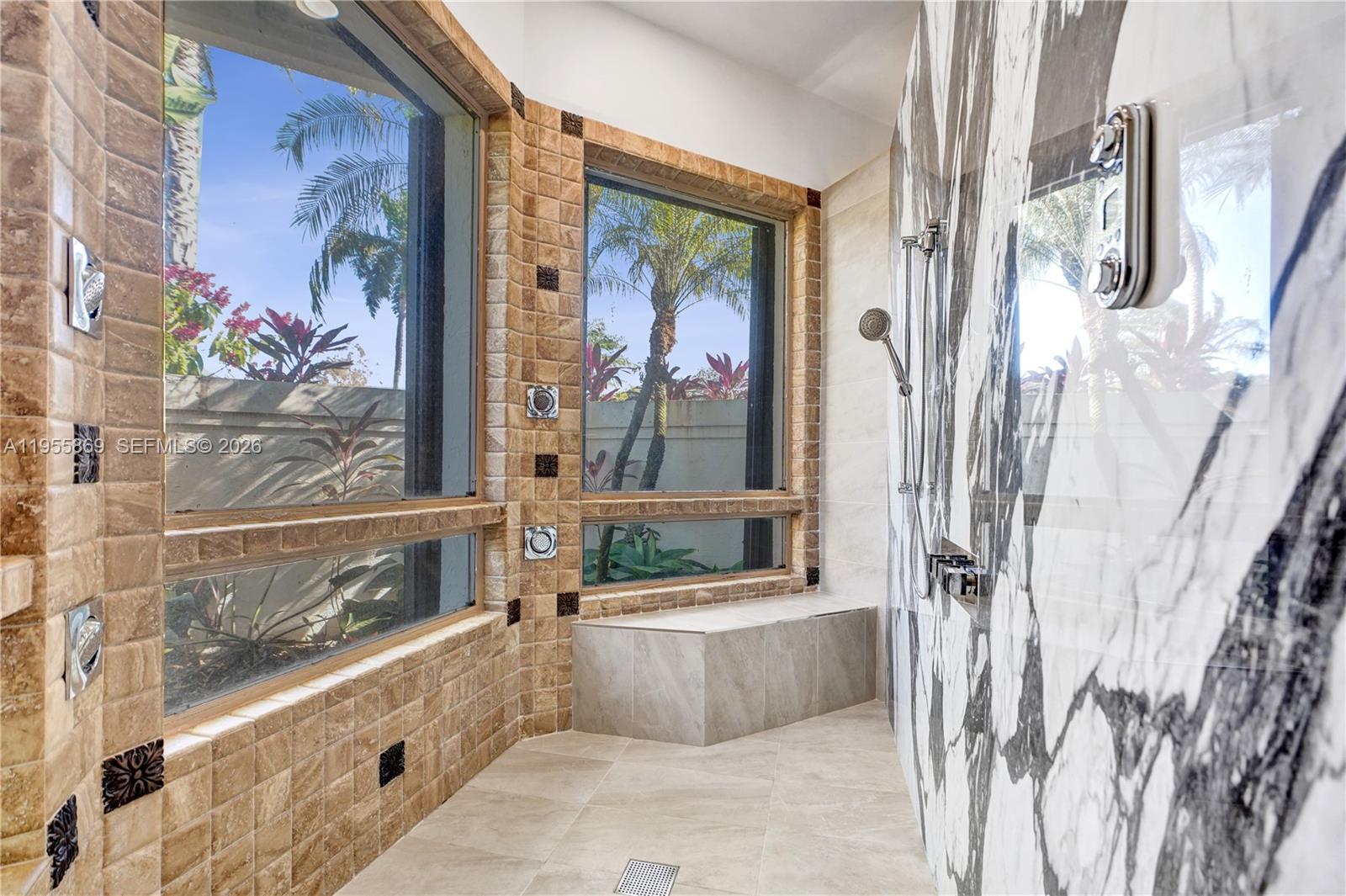 3175 Hunter Road Weston, FL 33331 - Photo 19 of 45 a bathroom with bathtub and a shower