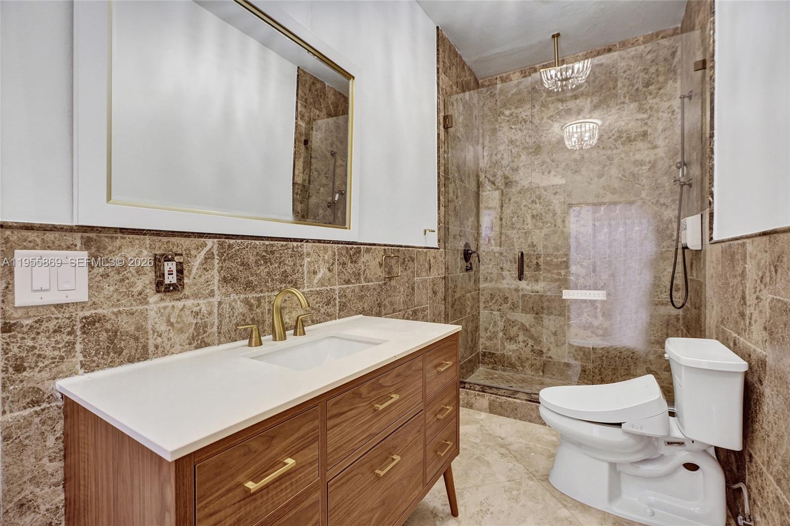 3175 Hunter Road Weston, FL 33331 - Photo 21 of 45 a bathroom with a sink vanity mirror and toilet