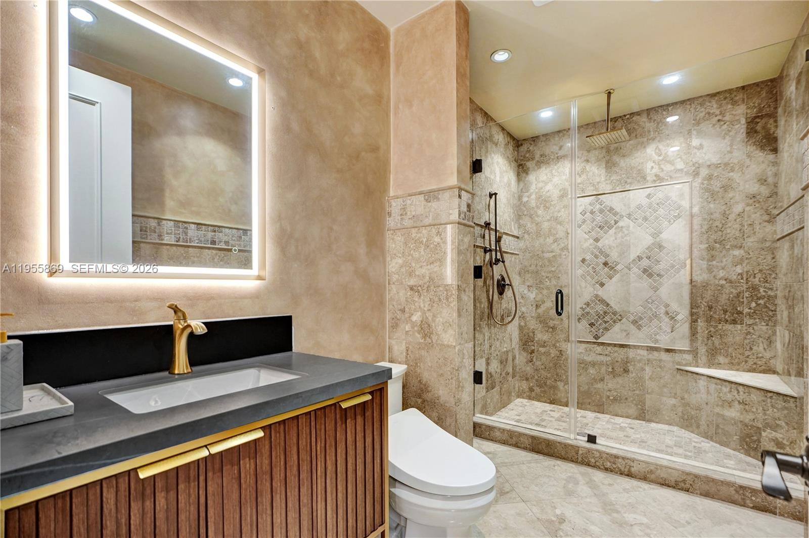 3175 Hunter Road Weston, FL 33331 - Photo 23 of 45 a bathroom with a sink a toilet and shower