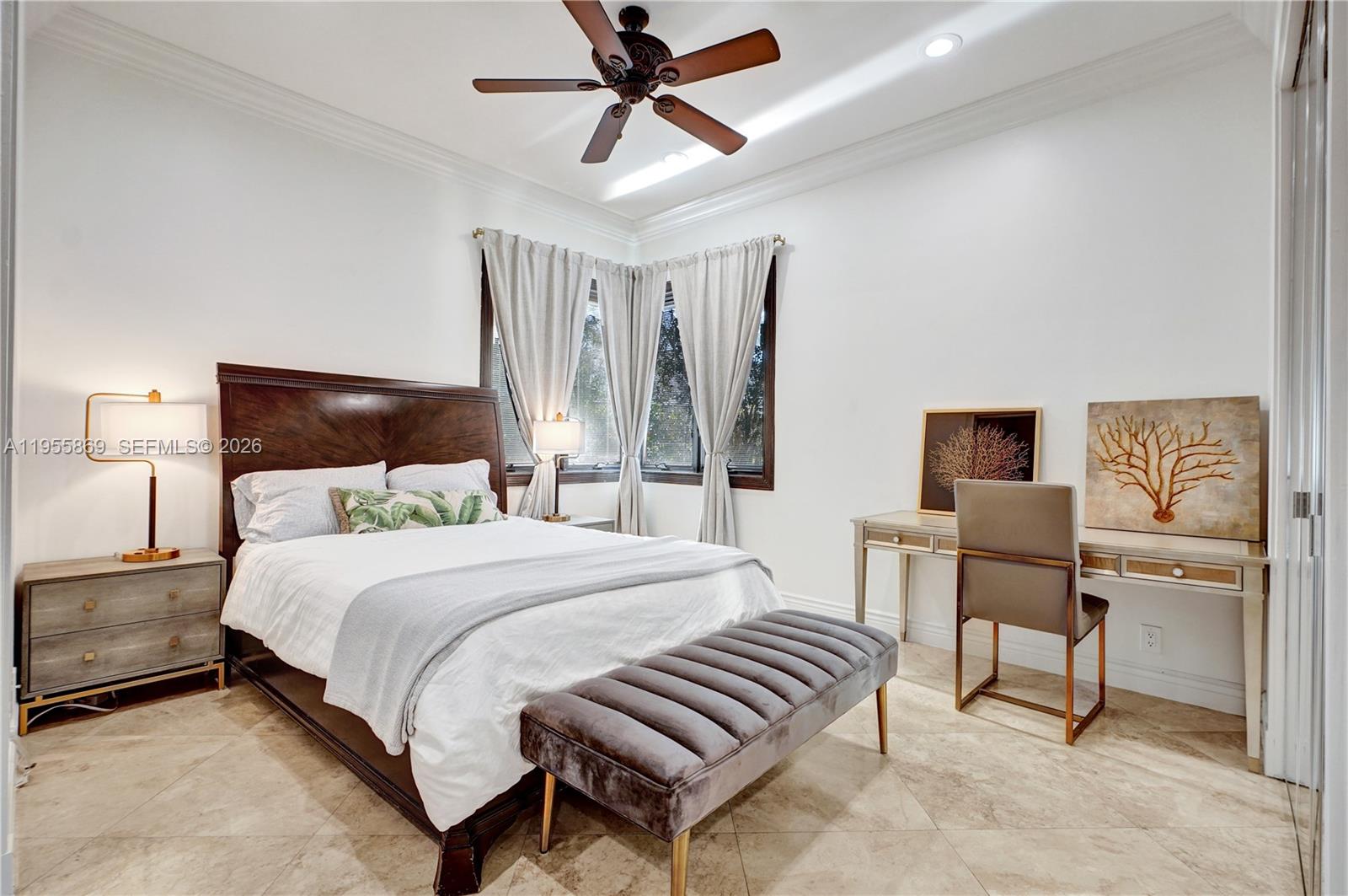 3175 Hunter Road Weston, FL 33331 - Photo 24 of 45 a bedroom with a bed and a chandelier